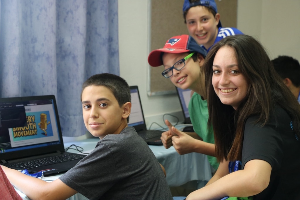 Summer School campers and counselor smiling